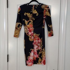 A XS mini quarter-sleeve dress with a floral pattern.